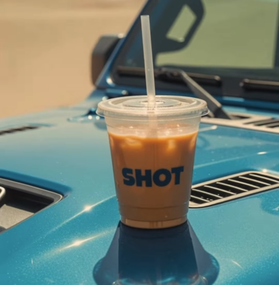 Iced coffee on a car hood